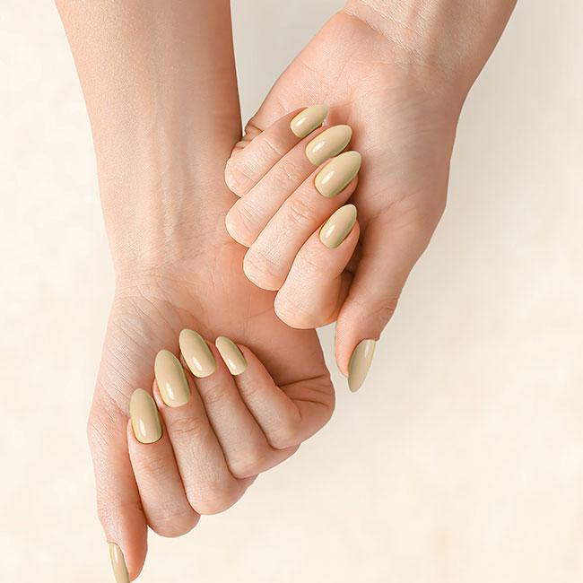 Almond nails in a creamy sage polish, hands intertwined